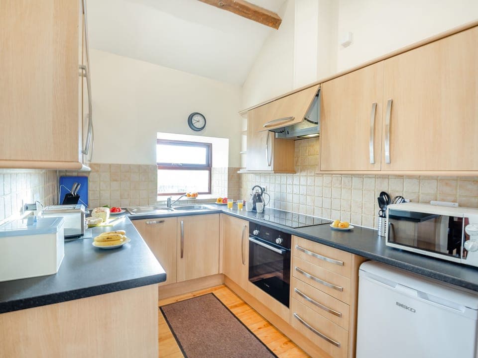 Cottage | Private kitchen | Stovetop, dishwasher, highchair, cookware/dishes/utensils