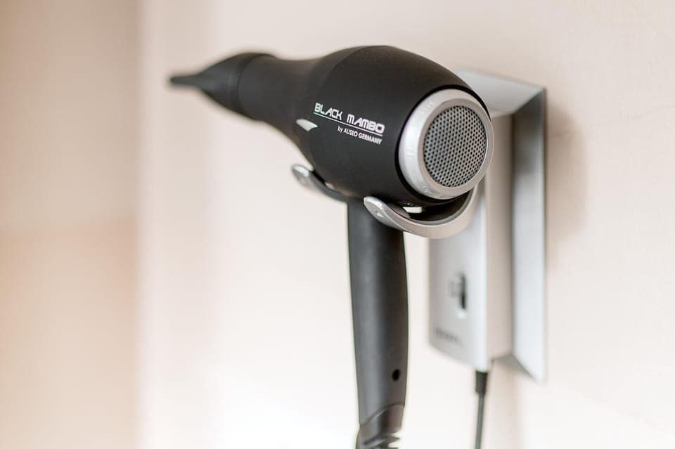 Deep soaking tub, rainfall showerhead, eco-friendly toiletries