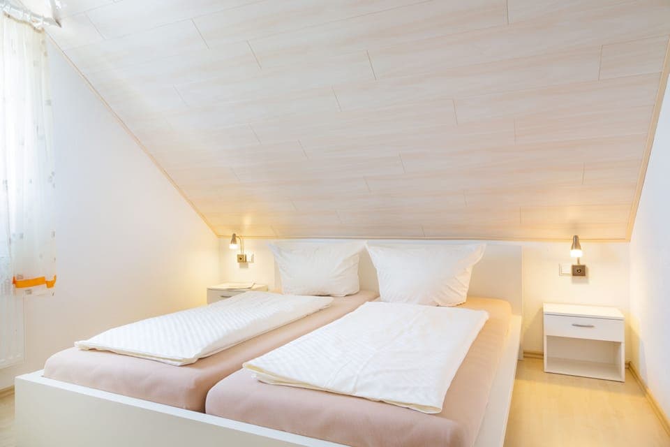 Family Apartment, 2 Bedrooms (Suedseite) | Minibar, free WiFi, bed sheets