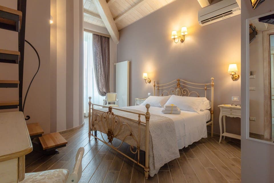 Superior Quadruple Room | Egyptian cotton sheets, down comforters, memory foam beds, minibar