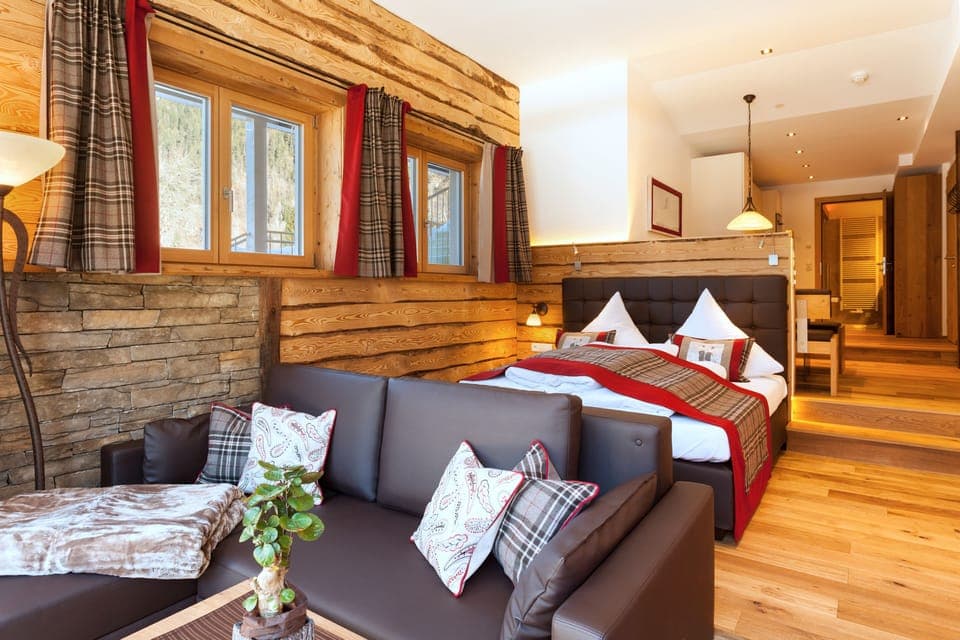 Deluxe Studio Suite | Living area | 26-inch flat-screen TV with cable channels, TV, toys