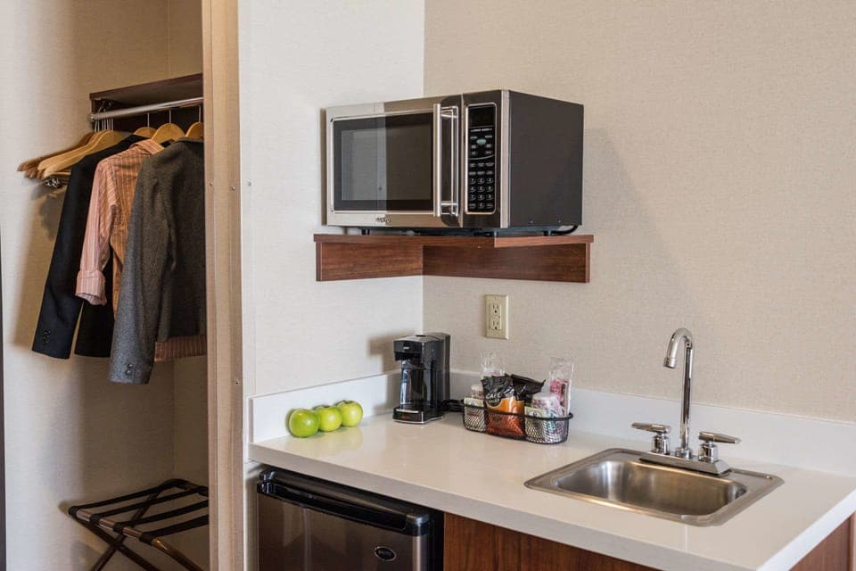 Desk, laptop workspace, blackout drapes, iron/ironing board