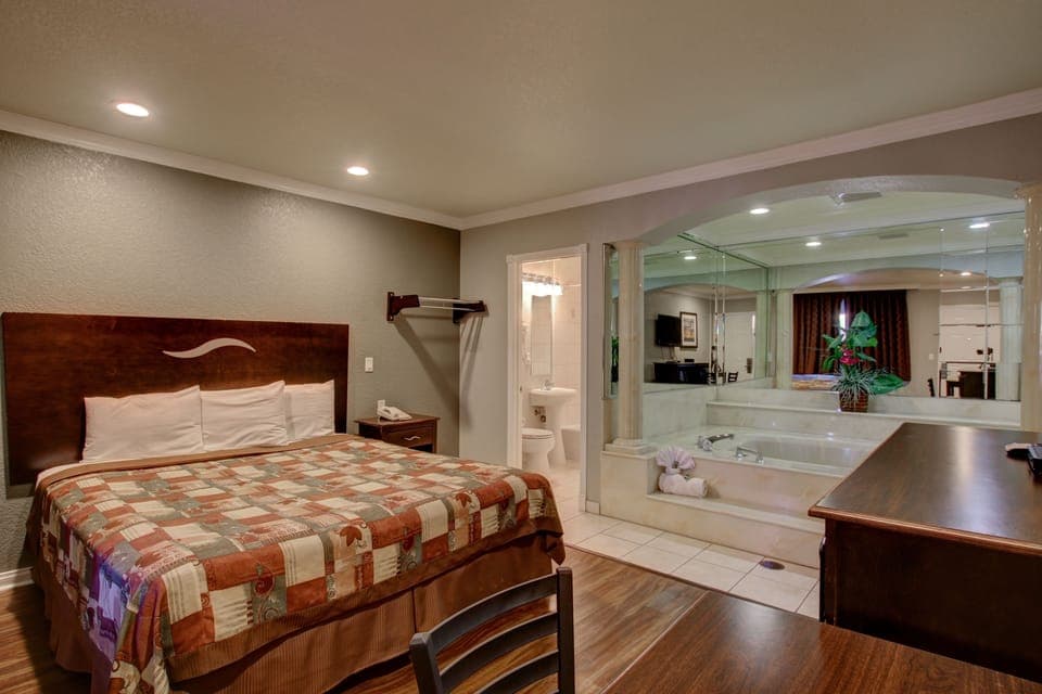 Room, 1 King Bed, Jetted Tub | Living area | LCD TV