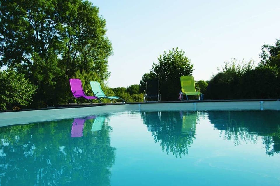 Seasonal outdoor pool, open 10:00 AM to 8:00 PM, pool umbrellas