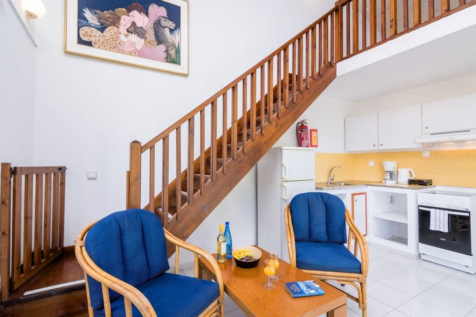 Duplex, 1 Bedroom, Mezzanine (Type C) | Living area | 32-inch flat-screen TV with satellite channels, TV