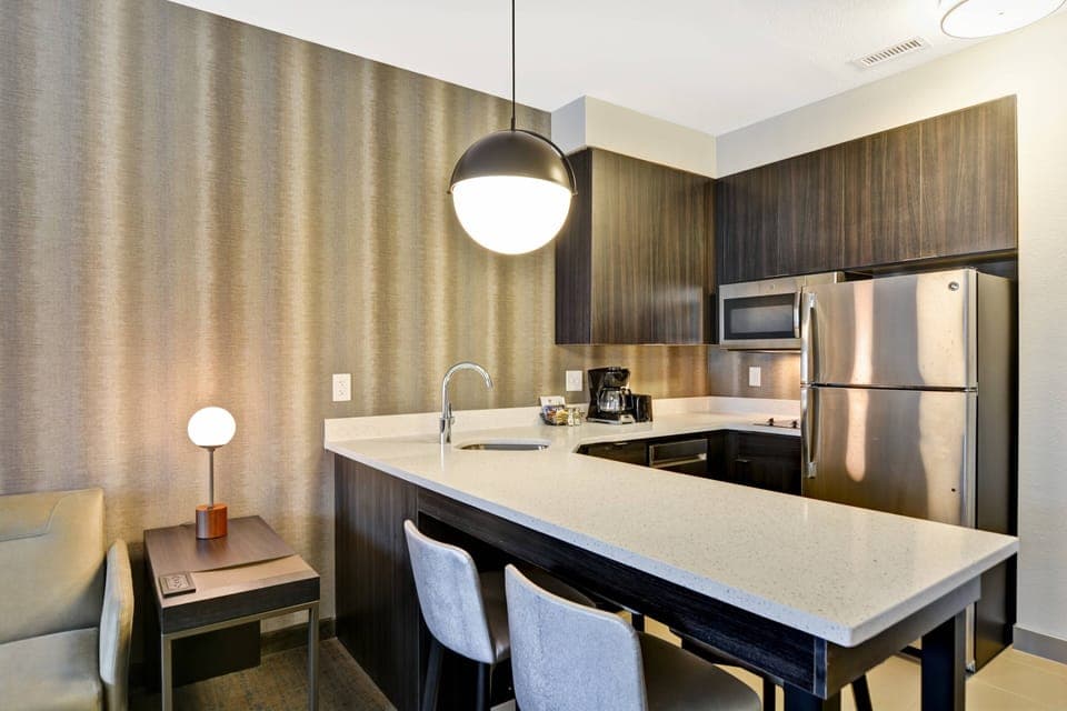 Full-size fridge, microwave, stovetop, dishwasher