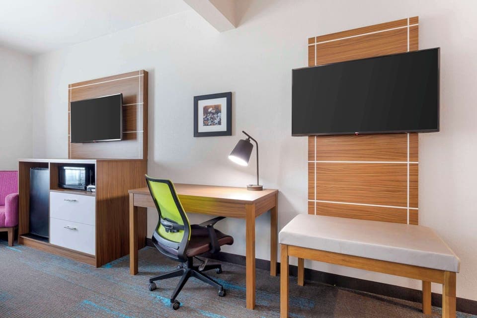 Desk, laptop workspace, iron/ironing board, cribs/infant beds