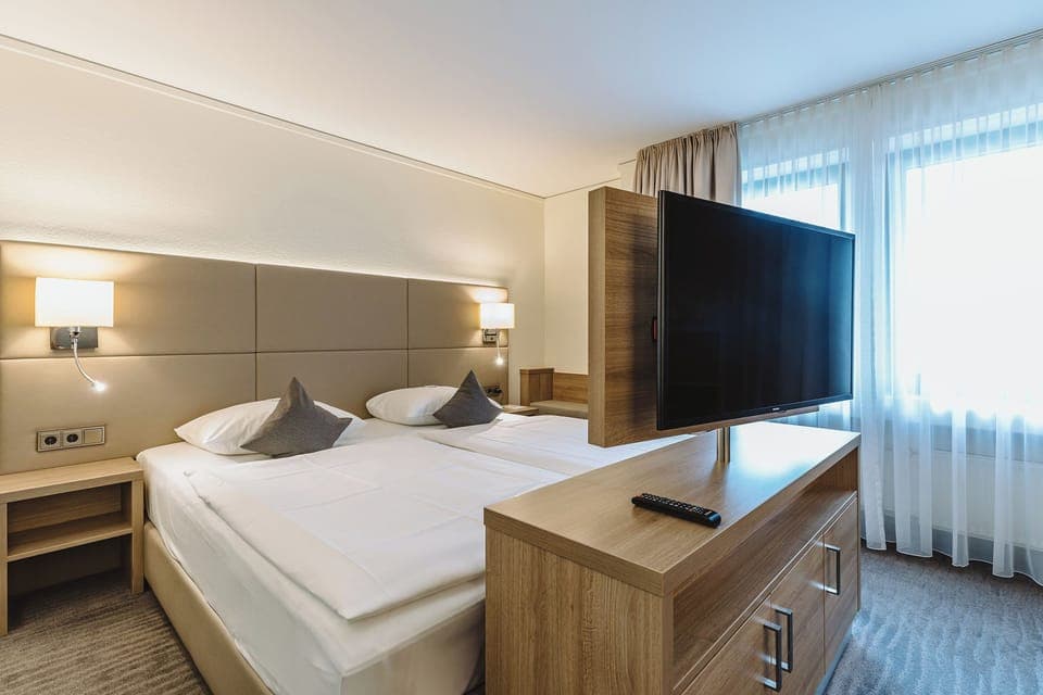 Hypo-allergenic bedding, in-room safe, desk, laptop workspace