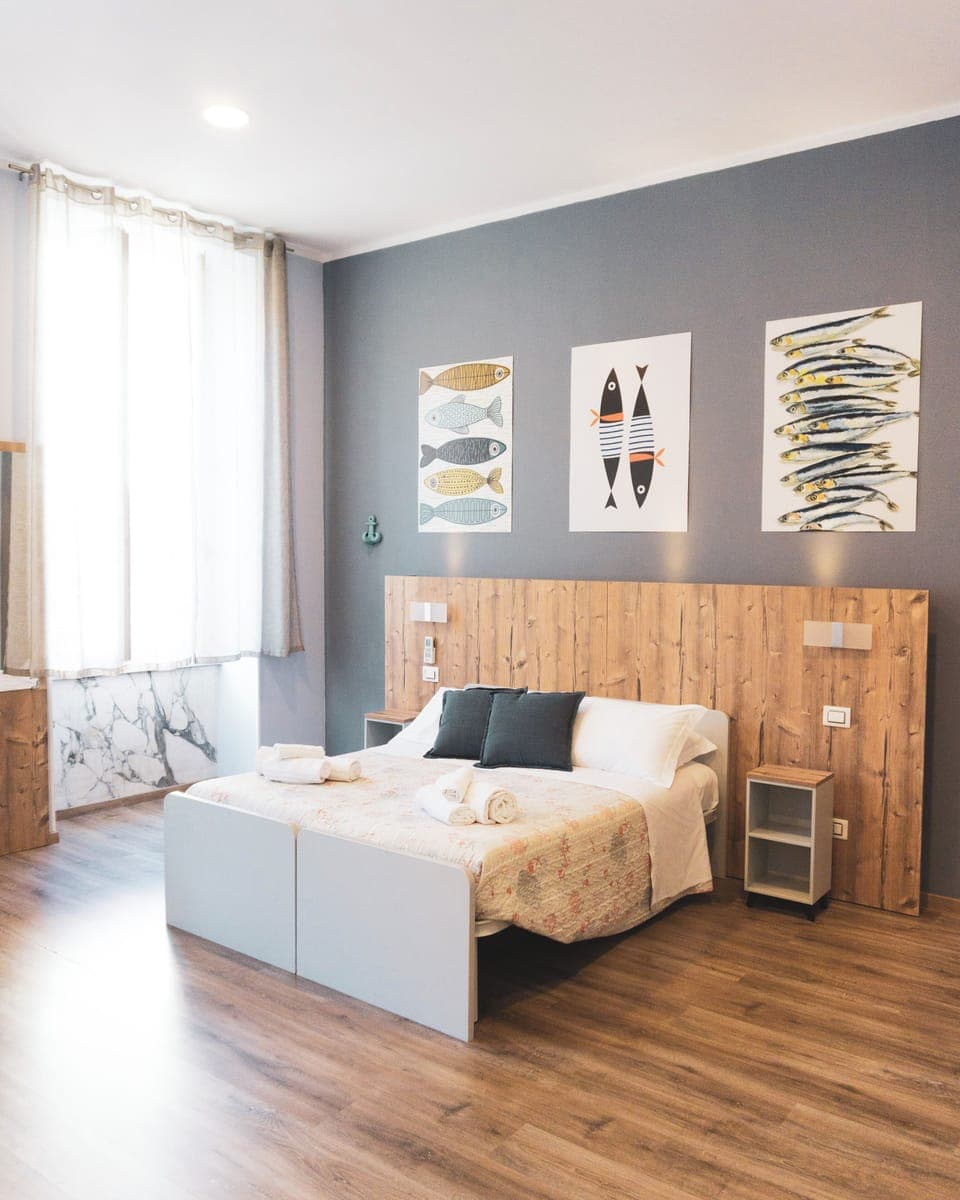 Comfort Quadruple Room | Minibar, in-room safe, desk, laptop workspace