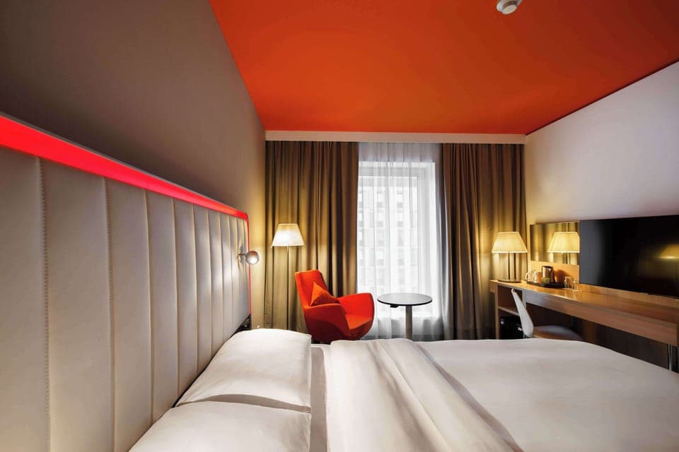 Hypo-allergenic bedding, desk, laptop workspace, blackout drapes