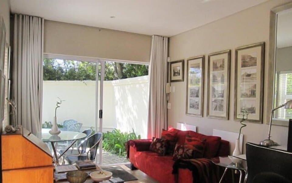 Cottage (Self Catering) | Living area | 92-cm plasma TV with satellite channels, TV, DVD player