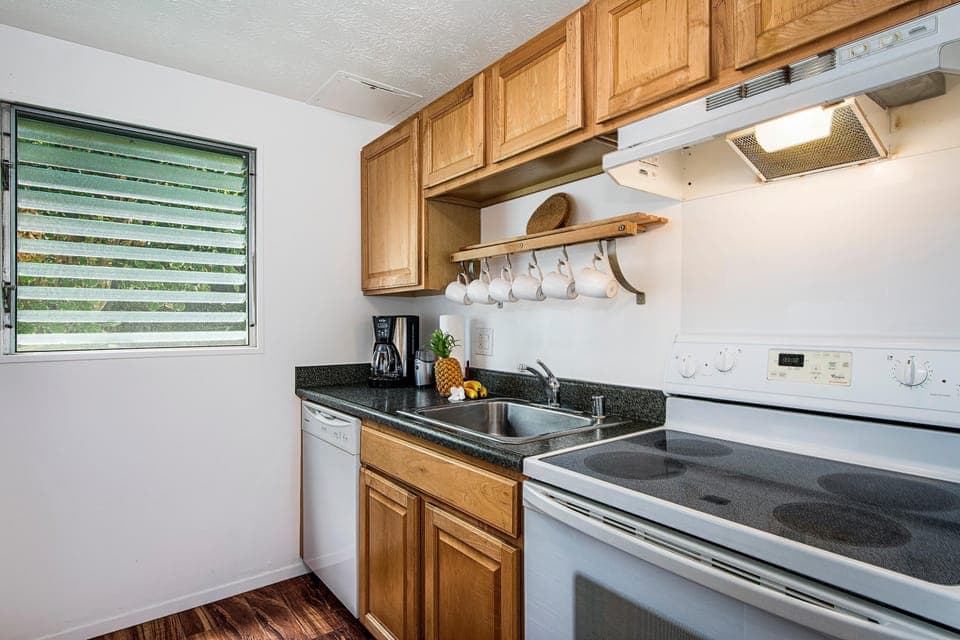 Condo, Multiple Beds, Partial Ocean View (Keauhou Kona Surf & Racquet Club #37) | Private kitchen | Full-size fridge, microwave, stovetop, dishwasher