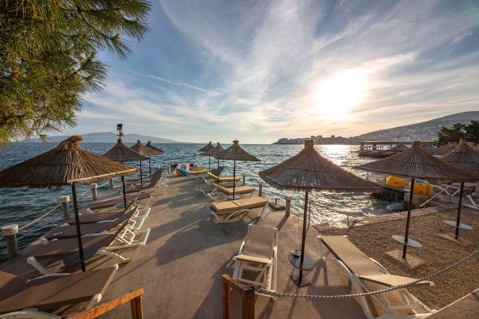 Private beach, white sand, sun loungers, beach umbrellas