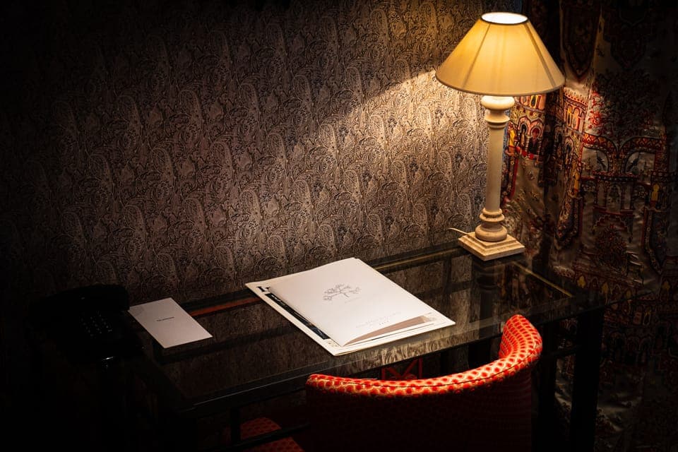 Deluxe Suite, Courtyard View | Living area | TV