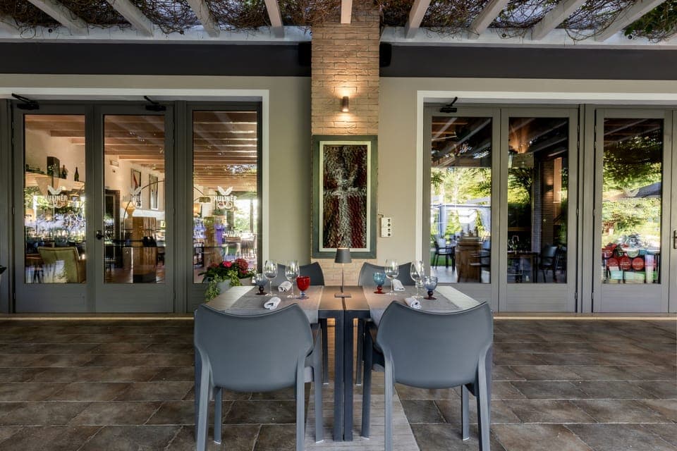 Breakfast, lunch, dinner served; Italian cuisine, garden views 