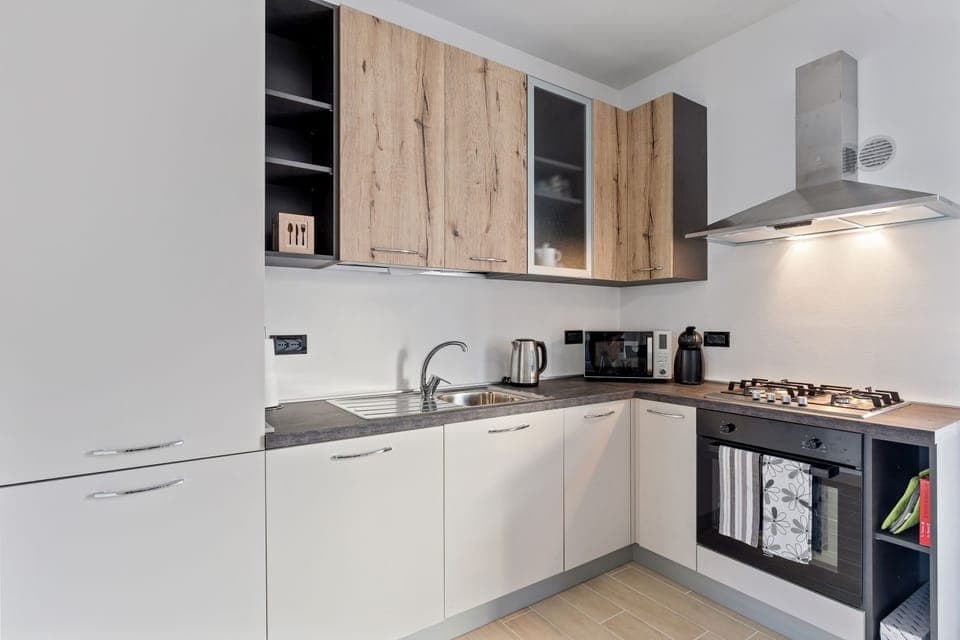 Apartment, 3 Bedrooms | Private kitchen | Full-size fridge, stovetop, electric kettle, cookware/dishes/utensils