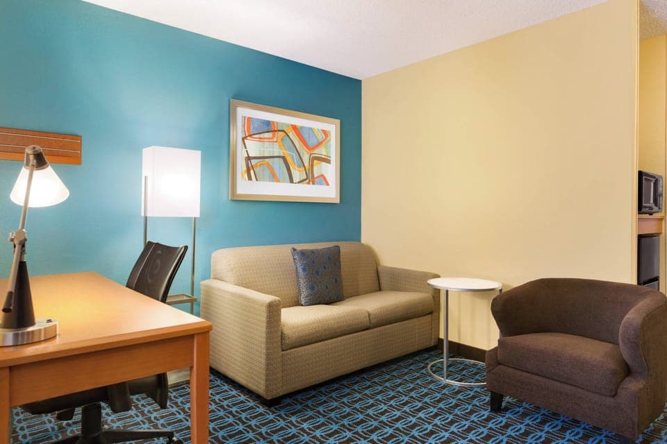 Suite, 1 King Bed with Sofa bed | Living area | 42-inch flat-screen TV with cable channels, TV, Netflix