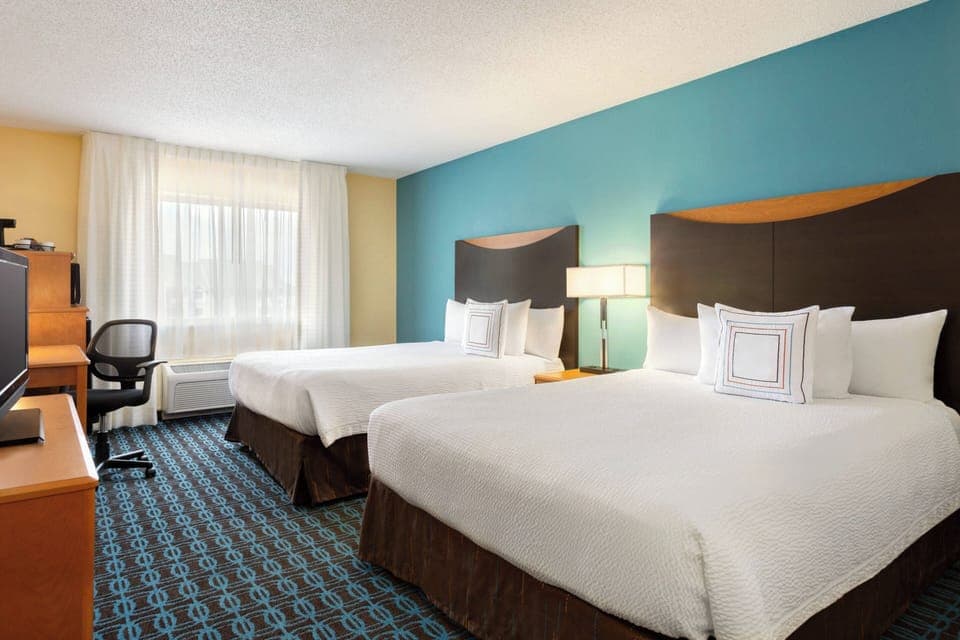Premium bedding, pillowtop beds, desk, laptop workspace