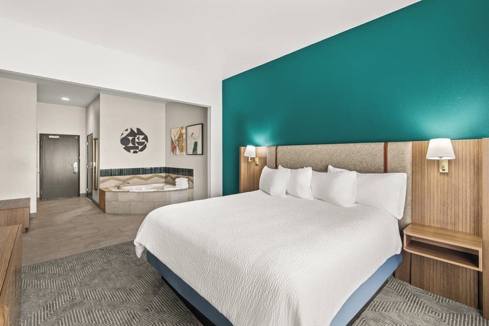 Suite, 1 King Bed (Additional Living Area) | Down comforters, in-room safe, desk, iron/ironing board