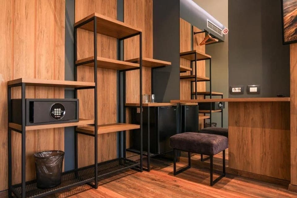 Deluxe Triple Room, Balcony, Partial Sea View | Minibar, in-room safe, desk, blackout drapes