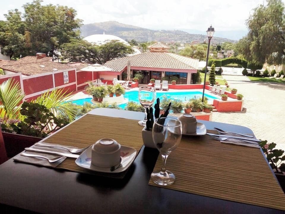 Breakfast, lunch, dinner served; local cuisine, pool views 