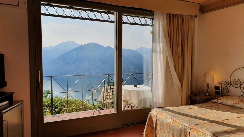 Double Room, Lake View | Down comforters, minibar, in-room safe, individually furnished