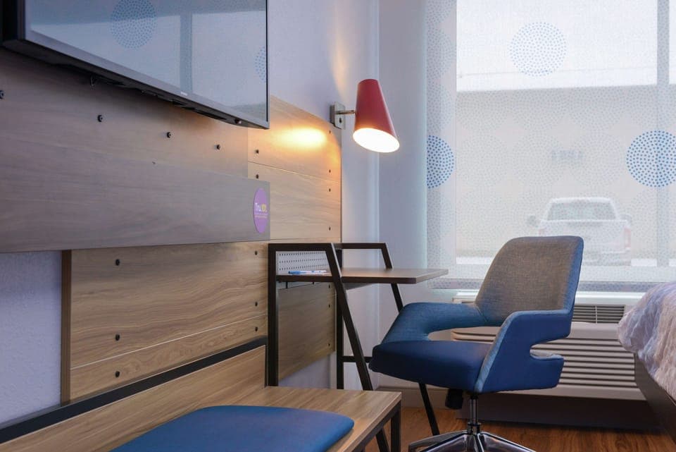 Desk, laptop workspace, blackout drapes, iron/ironing board