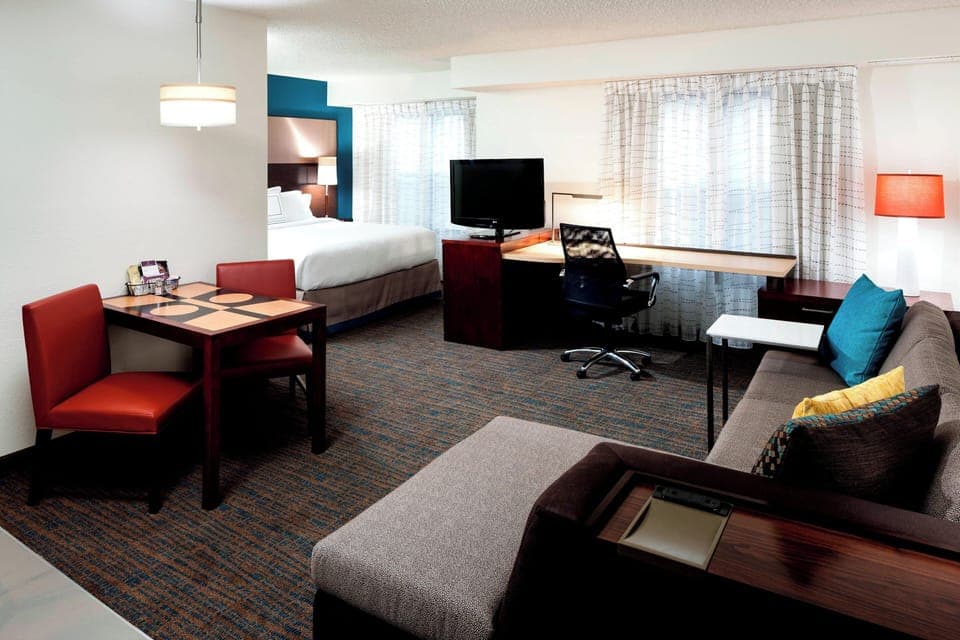 Premium bedding, desk, laptop workspace, iron/ironing board
