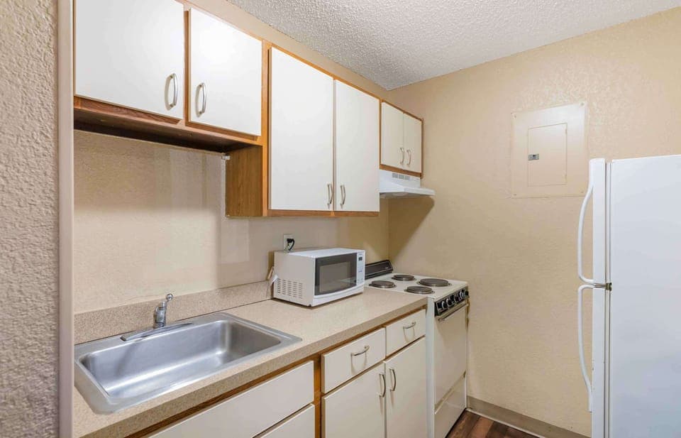 Fridge, microwave, stovetop, cookware/dishes/utensils