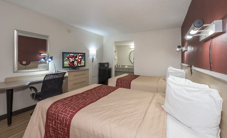 Deluxe Room, 2 Queen Beds, Non Smoking | Desk, laptop workspace, blackout drapes, free cribs/infant beds