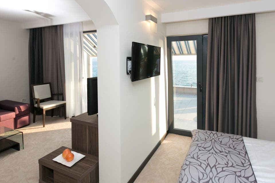 Superior Apartment, Terrace, Sea View | Living room | 85-cm LCD TV with satellite channels, TV
