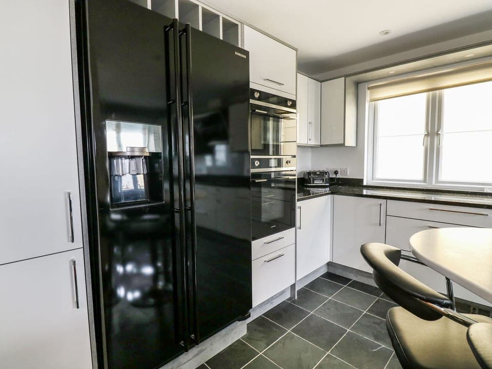 Cottage | Private kitchen | Stovetop, dishwasher, highchair, cookware/dishes/utensils