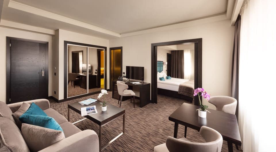 Superior Suite, City View | Living area | 105-cm Smart TV with satellite channels, TV