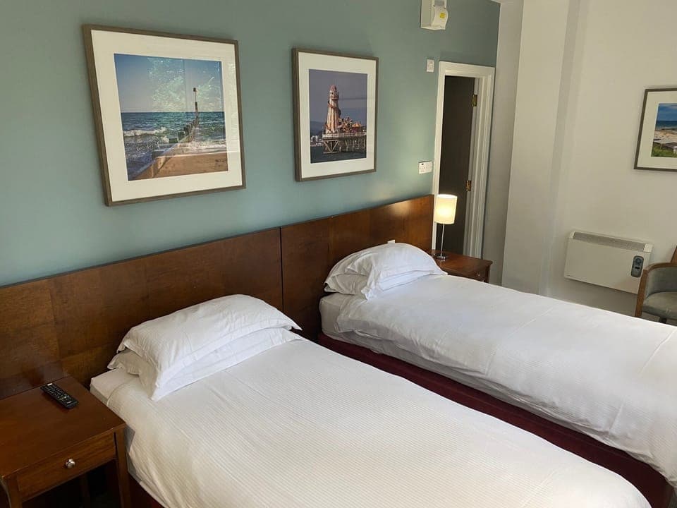 Twin Room | Premium bedding, down comforters, blackout drapes, iron/ironing board