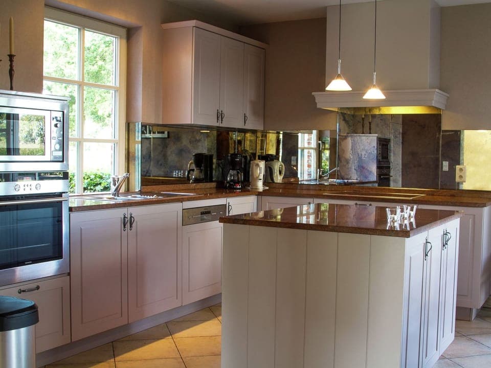 Villa | Private kitchen | Fridge, microwave, oven, highchair