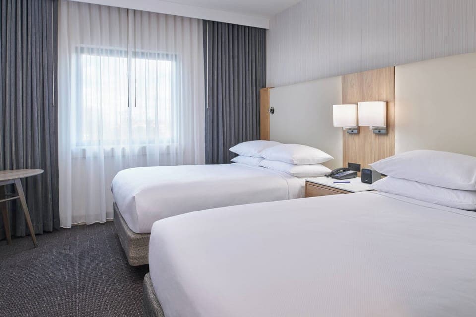 Room, 2 Double Beds | Hypo-allergenic bedding, down comforters, in-room safe, desk