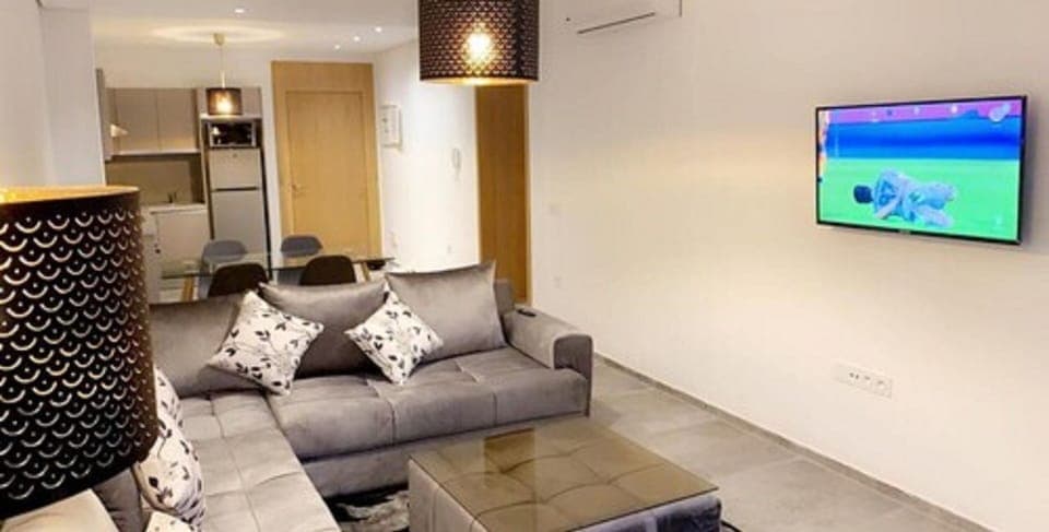 Apartment, 2 Bedrooms | Living room | Flat-screen TV