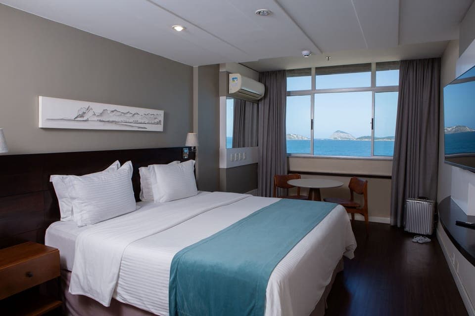 Deluxe Room, Beach View | Pillowtop beds, minibar, in-room safe, individually decorated