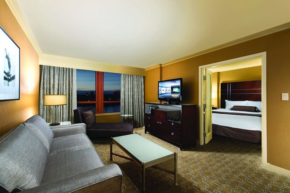 1 Bedroom Marina View Suite (Casino Tower) | Living room | 42-inch LCD TV with cable channels, TV, iPod dock