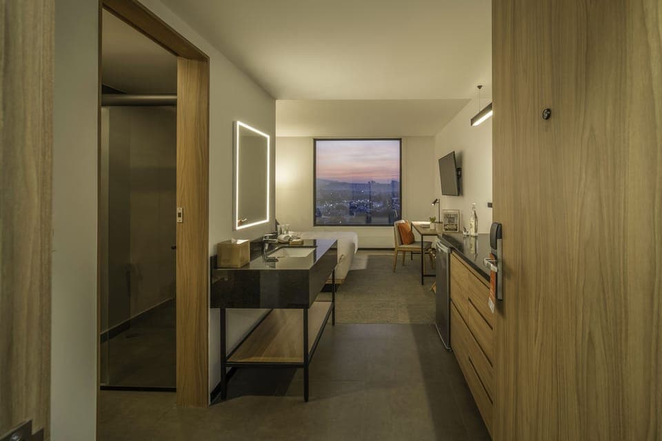 Shower, designer toiletries, hair dryer, towels