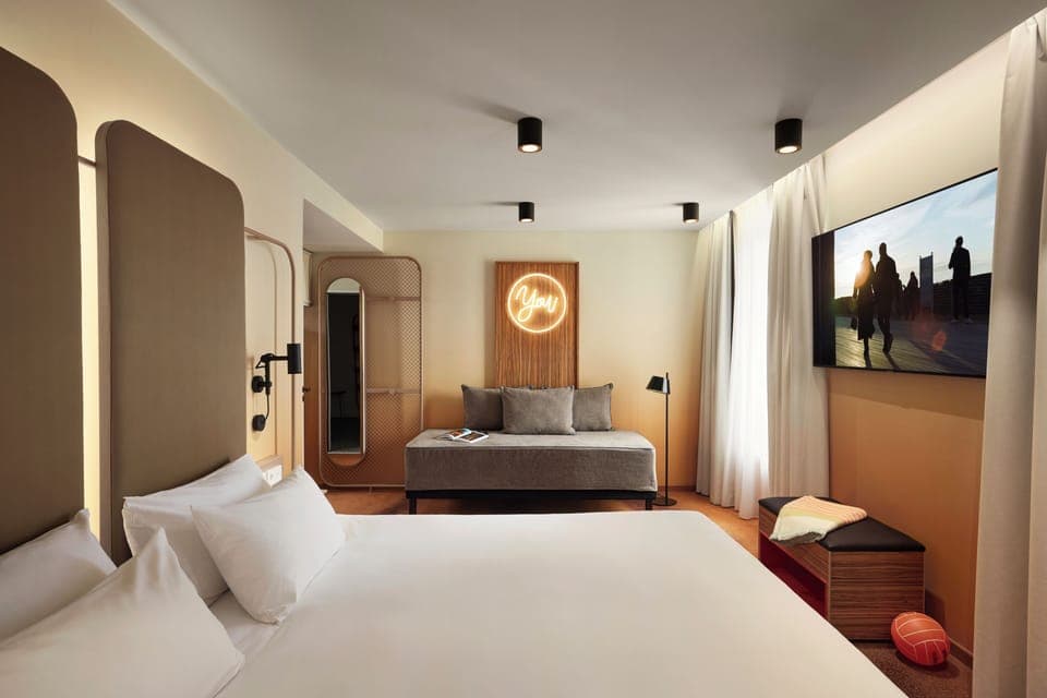 Premium bedding, laptop workspace, blackout drapes, soundproofing