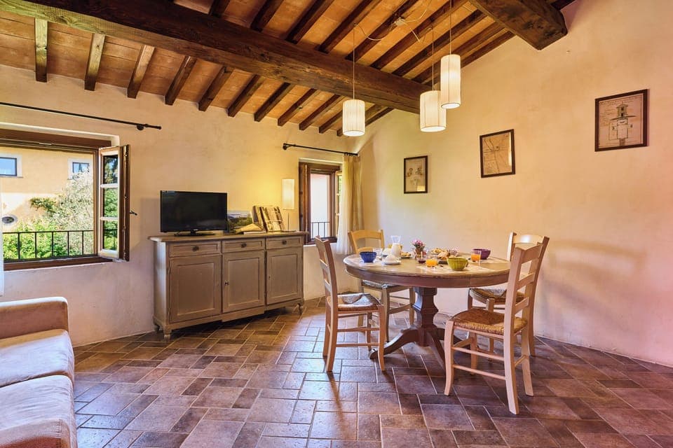 Family Apartment | Living area | 20-inch flat-screen TV with satellite channels, TV, heated floors