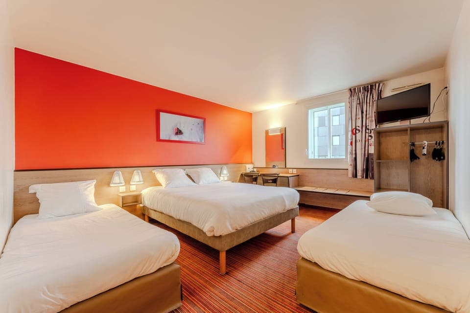 Family Room | Premium bedding, individually furnished, desk, blackout drapes