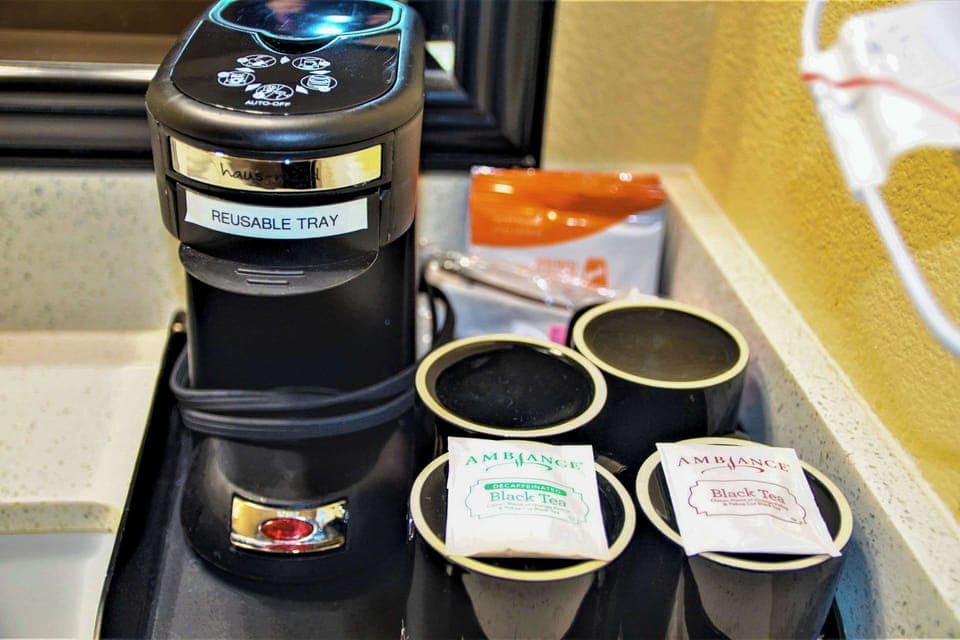 Premium bedding, desk, laptop workspace, blackout drapes