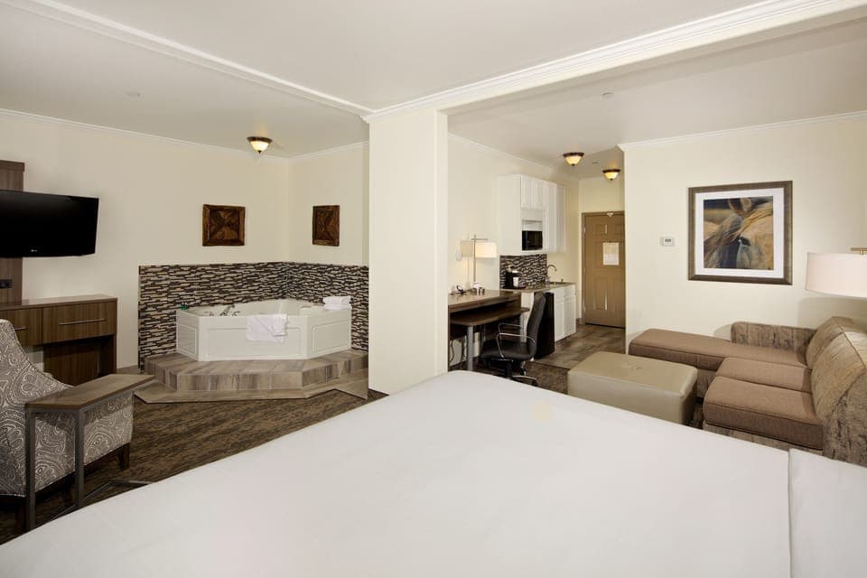 Suite, 1 King Bed, Jetted Tub | Pillowtop beds, desk, laptop workspace, blackout drapes