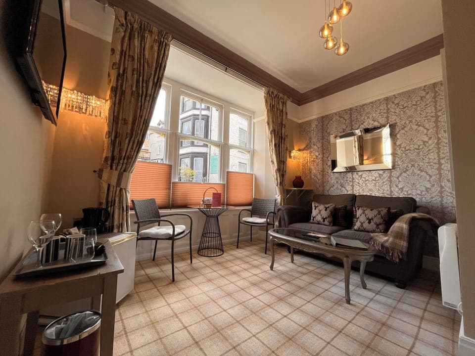 Suite, Balcony (Rydal) | Living area | TV, fireplace