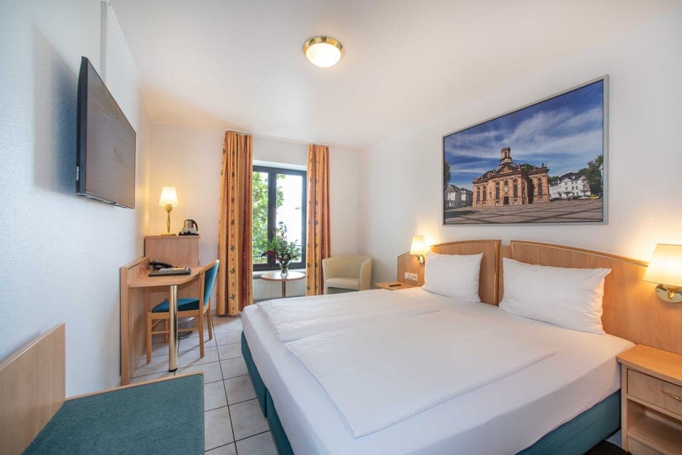 Desk, laptop workspace, free WiFi, bed sheets