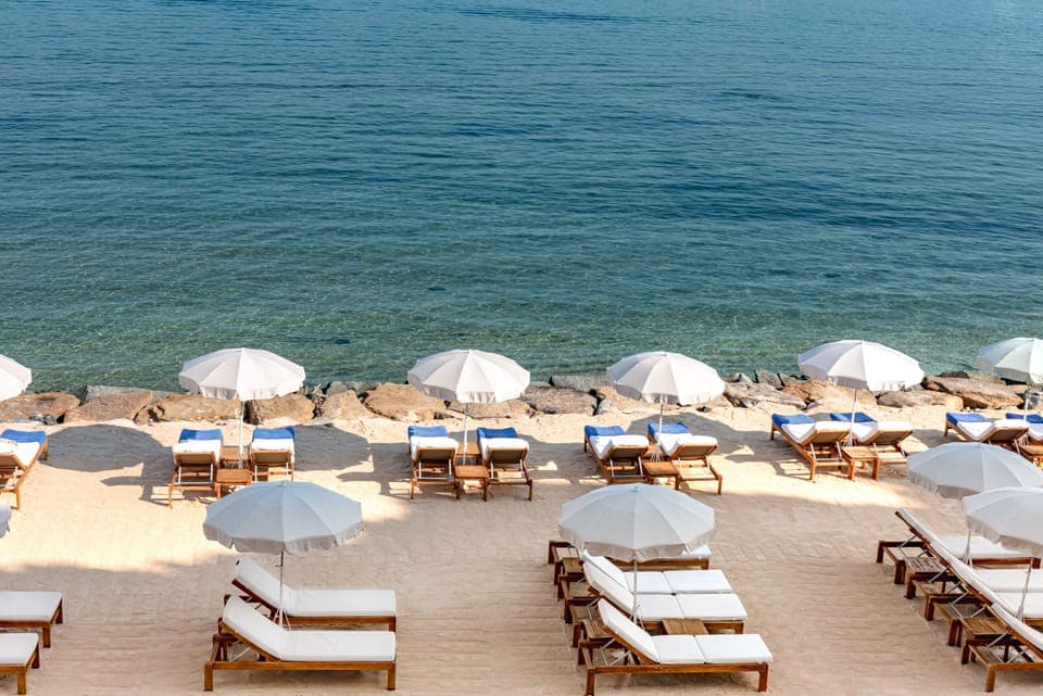 On the beach, sun loungers, beach umbrellas