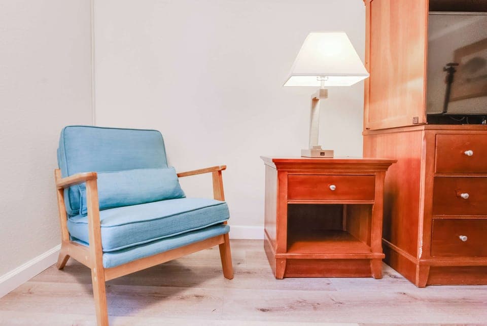 Premium bedding, desk, laptop workspace, blackout drapes