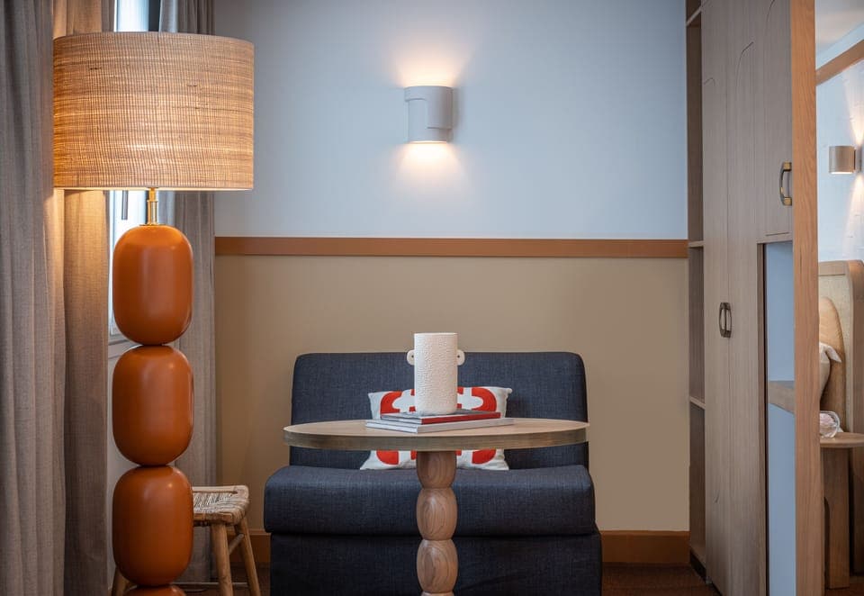 Deluxe Triple Room | Living area | Flat-screen TV, iPod dock